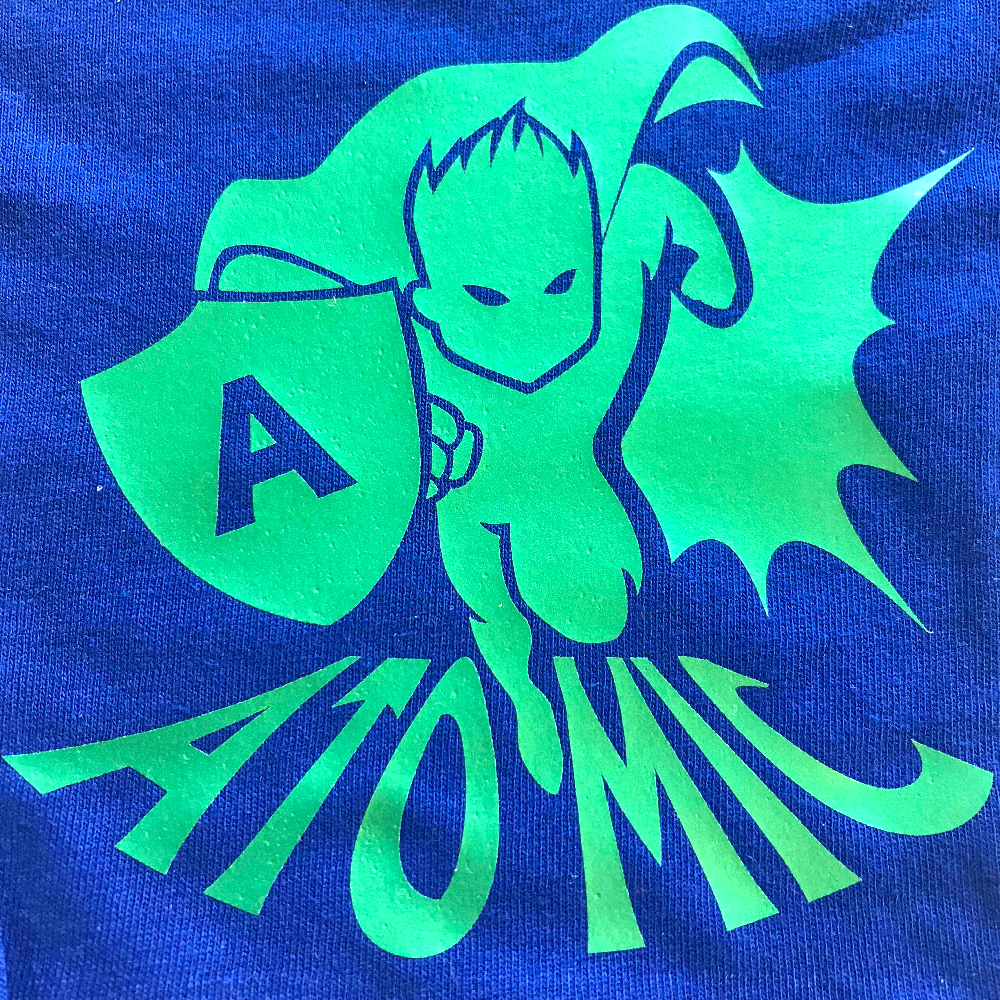 Blue fabric with super hero design made with Sef Flex Cut Atomic Green Vinyl