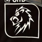 White Lion Logo design on shirt made with Sef Flex Cut Sticky Glow In The Dark Vinyl