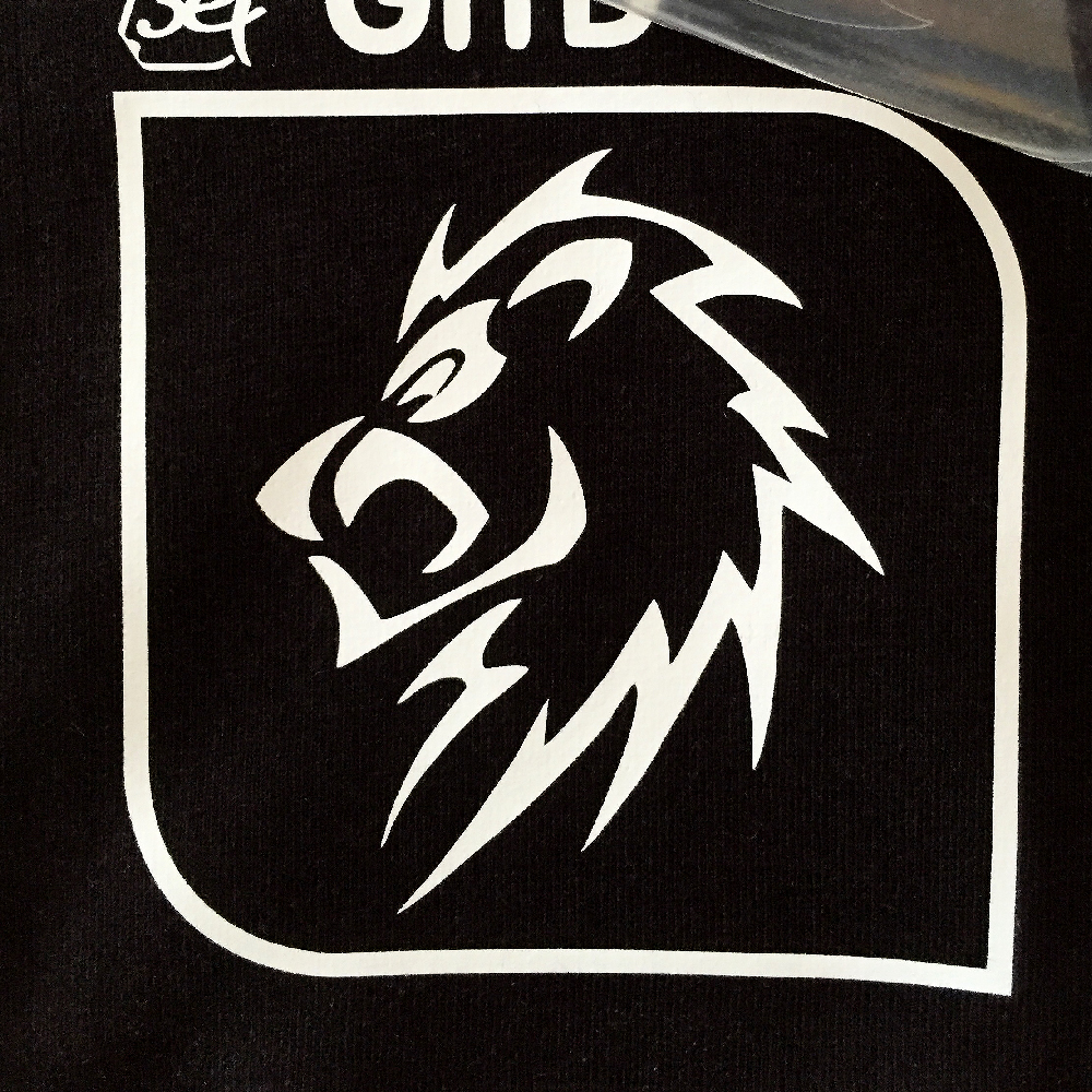 White Lion Logo design on shirt made with Sef Flex Cut Sticky Glow In The Dark Vinyl