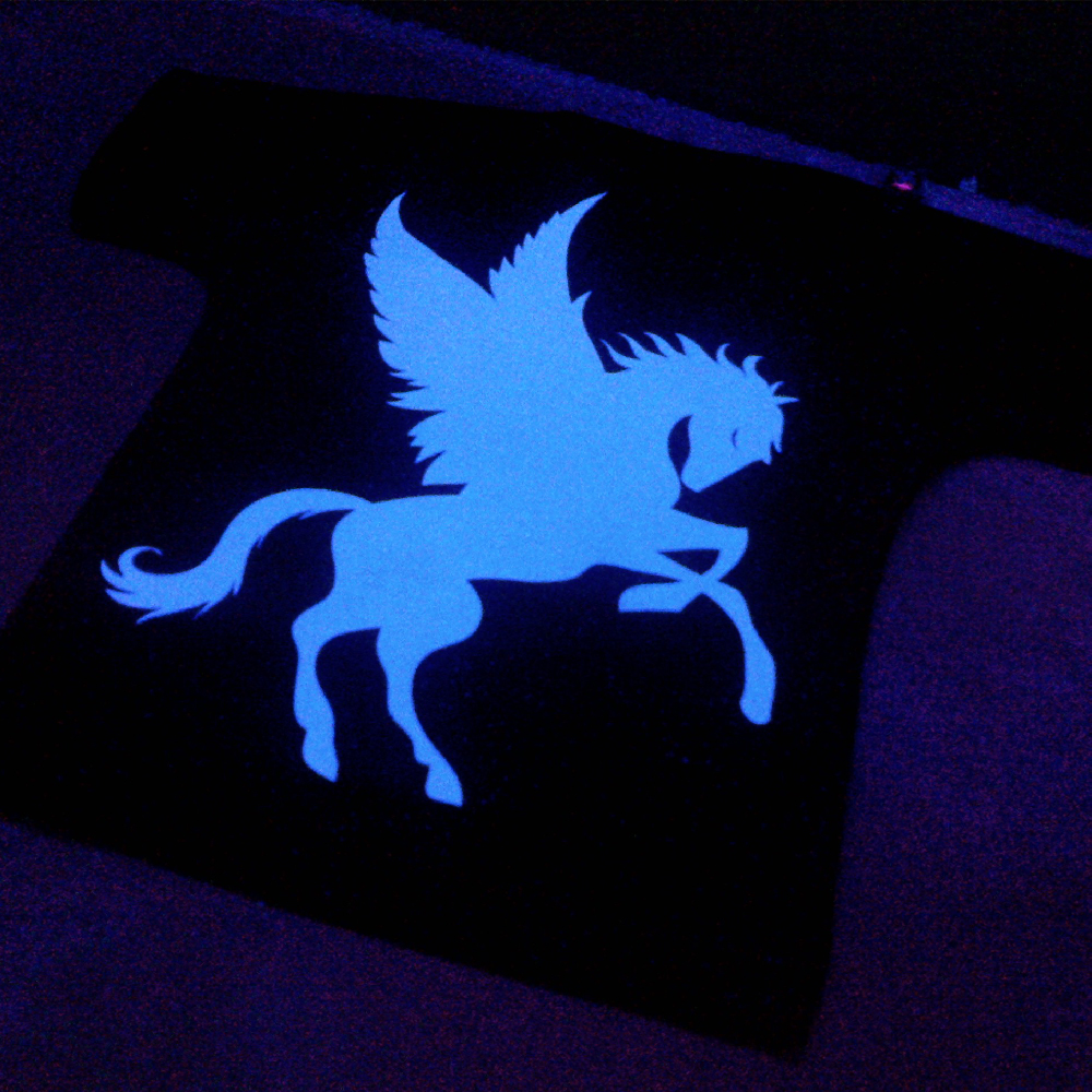 T-Shirt under UV Lamp showing glow in the dark designs made with Sef Flex Cut Sticky Night Club Vinyl