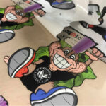 Monkey Stickers being weeded from sheet made with Sef MoZaic 500mm wide Vinyl