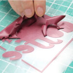 Red coffee design being weeded using Sef Maxxflex Vinyl