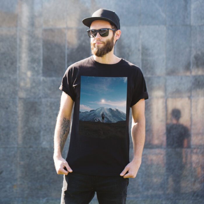 Man outside in black t-shirt with block image print of mountains printed with Forever Laser Dark Cuttable Paper