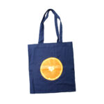 Navy Blue Tote Bag with print of Orange Slice printed using Forever Laser Dark Cuttable Paper on white background