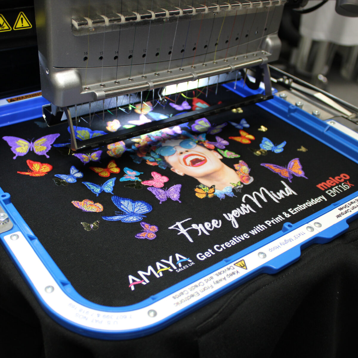 Melco EMT16X Embroidery Machine with 11x13" Mighty Hoop embroidering on a garment