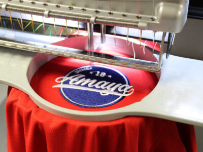 garment in a mighty hoop on a melco emt16x modular embroidery machine