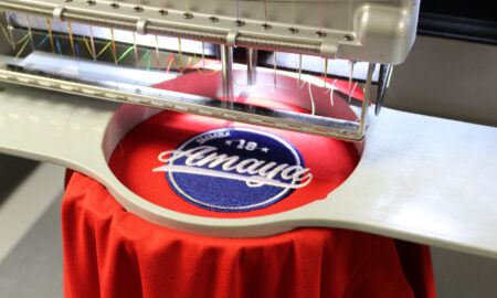 garment in a mighty hoop on a melco emt16x modular embroidery machine