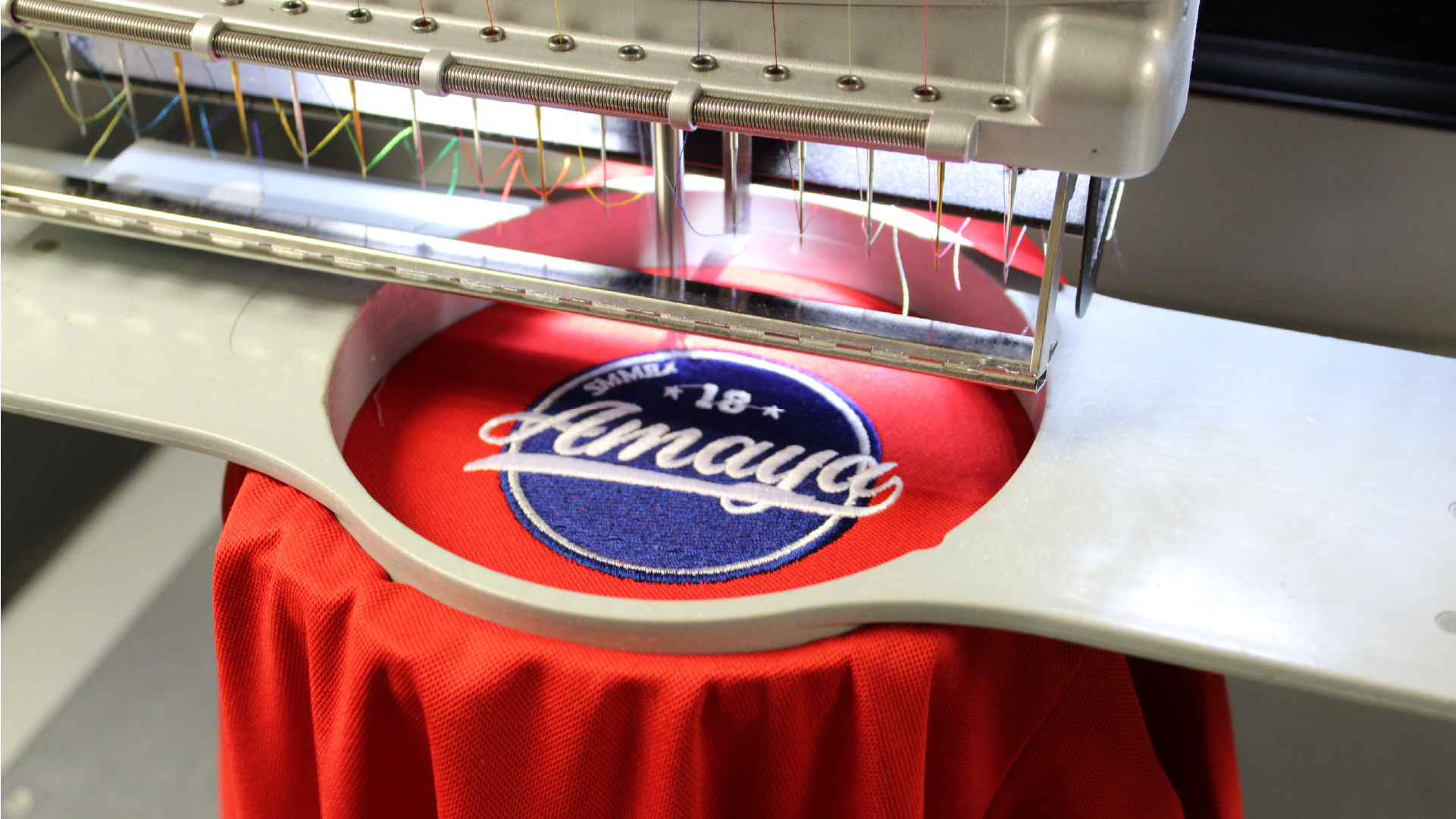 garment in a mighty hoop on a melco emt16x modular embroidery machine