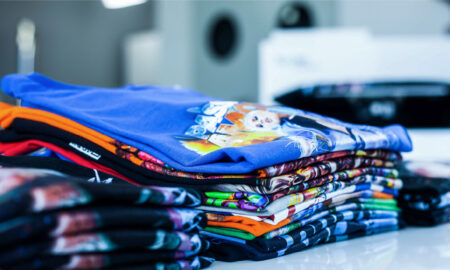 stack of t-shirts printed with texjet direct to garment printers