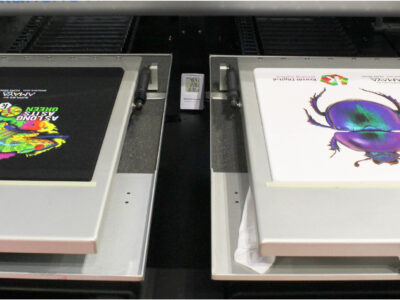 Two printing pallets on a kornit digital direct to garment printer